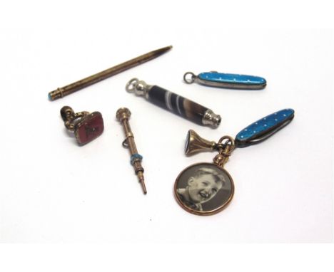 A MINATURE PEN KNIFE with blue and white polka dot enamel body; with a matching button hook; two small seal fobs; a 9 carat g