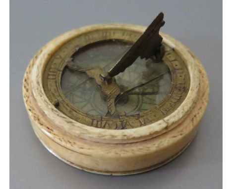 An Early Ivory Cased Pocket Compass Sundial, 4cm diam. (glass cracked, compass not working and screw on cover missing) 