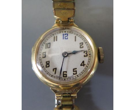 A VISIBLE 18ct Gold Ladies Manual Wind Wristwatch with plated bracelet, winds and runs 