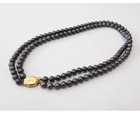A Two Strand Black Pearl Necklace with 18ct yellow gold clasp, c. 41cm, 54.5g 