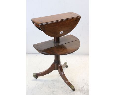 George III and later mahogany two tier dumb waiter, with graduated twin dropleaf tiers, outswept tripod base, brass cappings 