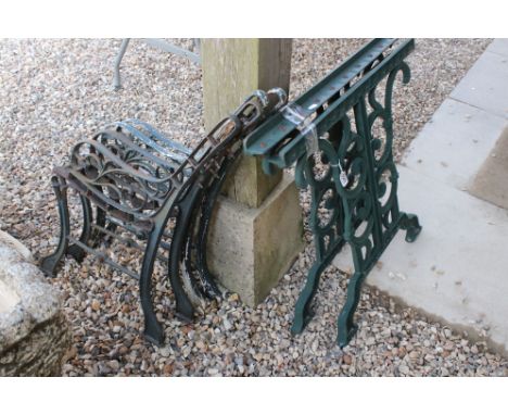Three sets of wrought iron garden bench ends 
