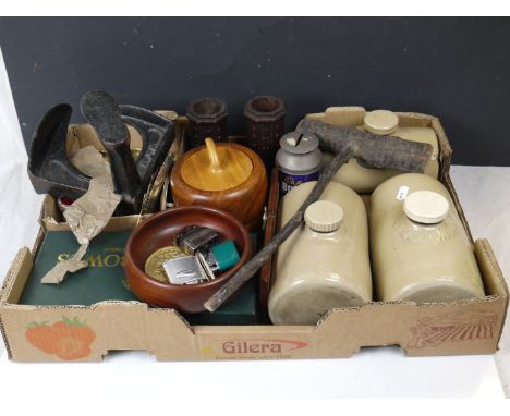 A box of mixed collectables to include ceramic hot water bottles, lighters, carpet bowls and a shoe last. 