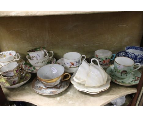 A quantity of cup and saucers to include Minton, Augustus Rex etc. 