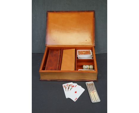 A cased Bridge set to include playing cards, score books and pens contained within a book shaped box. 