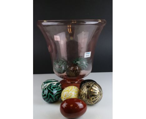 A large rose art glass vase together with a selection of ceramic decorative eggs. 