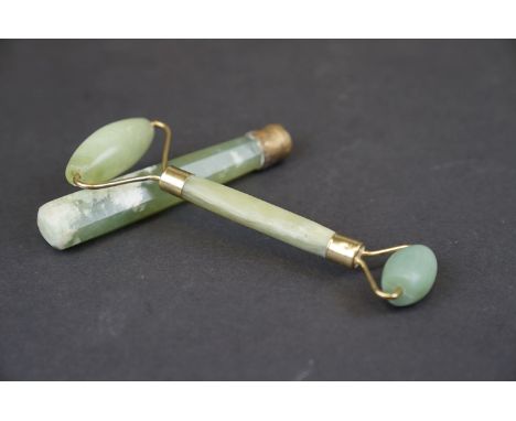 A oriental Jade double ended roller with brass mounts together with a Jade handle. 