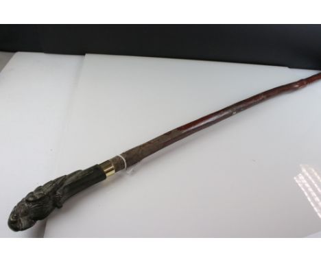 Walking stick with metal handle in the form of a parrot 