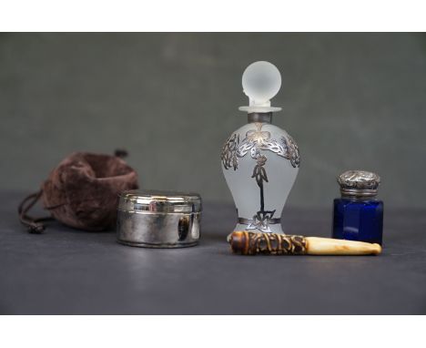Two scent bottles with white metal mounts together with a trinket box and a bone cheroot holder. 