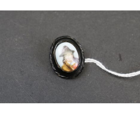 A vintage bog oak brooch with painted portrait panel. 
