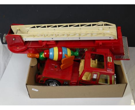 A vintage wooden Brio toy train together with a large metal Nylint toy fire engine. 