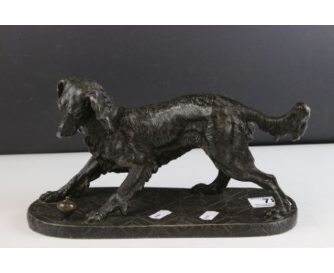 Spelter Model of a Collie Dog playing with a Spinning Top, 27cms long 