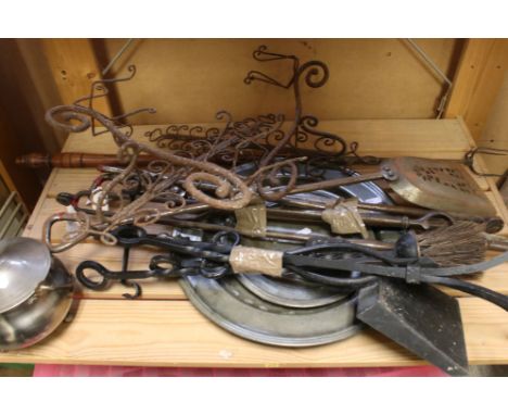 A collection of fire side companion tools together with a group of pewter plates. 