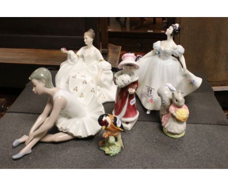 A collection of mixed ceramics to include three Royal Doulton figurines, two Beswick ornaments and a Nao ballerina. 