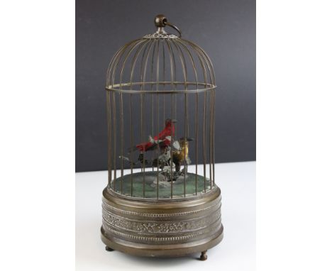 A Singing Bird Automaton, Mid century, with two bird's sat within foliage, contained in a bronzed metal domed top bird cage, 