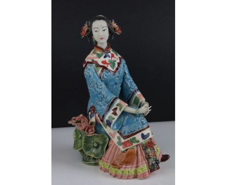 An Oriental Shi Wan ceramic pottery figure of  a seated  lady. 
