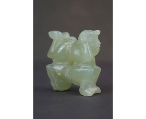 A oriental carved Jade ornament of two circus performers. 