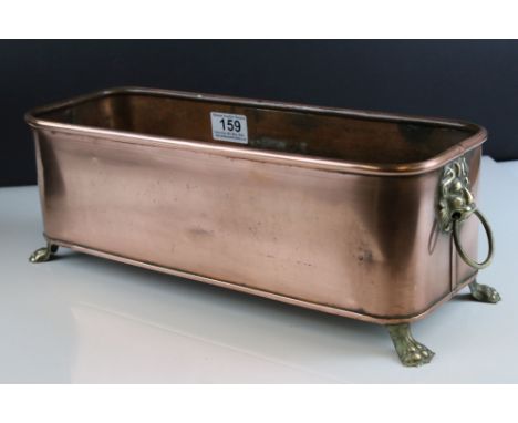 Copper Rectangular Planter with Brass Lion Mask Ring Handles and raised on Four Brass Lion Paw Feet, 40cms long x 13cms high 