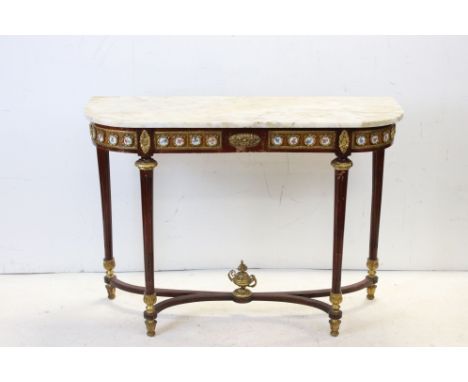 French Marble Top Console Table, the base inlaid with panels of Kingwood with gilt metal mounts and porcelain panels decorate