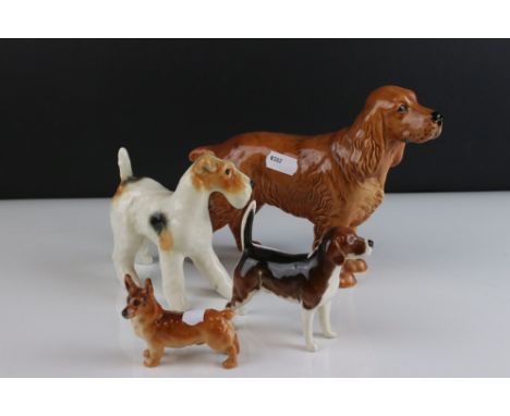 Four Beswick Dogs including Corgi, Beagle, Cocker Spaniel and Terrier, walking 