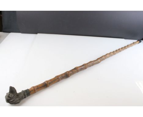 Walking stick with metal handle in the form of a dog 