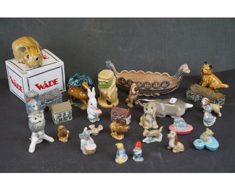 A collection of Wade ceramic ornaments to include animals and houses together with other ceramics. 