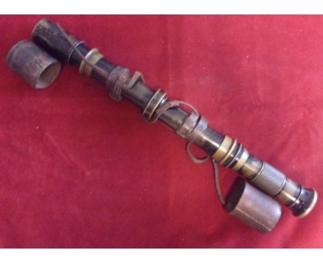 British WWI 18Pr Artillery Sighting Scope. It is made of brass with a black painted finish, although the paint has worn away 