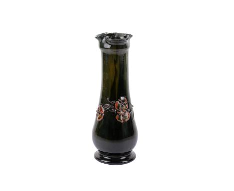 An early 20th century Elton ware pottery green trumpet vase. Green streaked ground with relief patterning of flowers in pink,