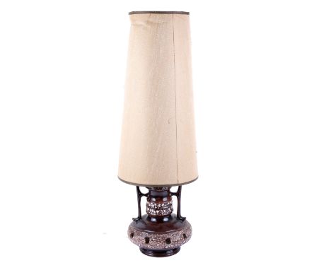A mid century West German pottery 'fat lava' table lamp. Having twin handles and pierced base, brown and white glaze. Height 