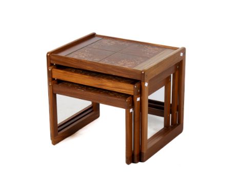 A mid-century nest of three tile top tables. With leaf decoration to the tiles. Max. H50cm x W59cm x D46cm