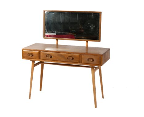 A circa 1960s Ercol 'Windsor' light elm dressing table. The rounded rectangular top mounted by rectangular mirror, over three
