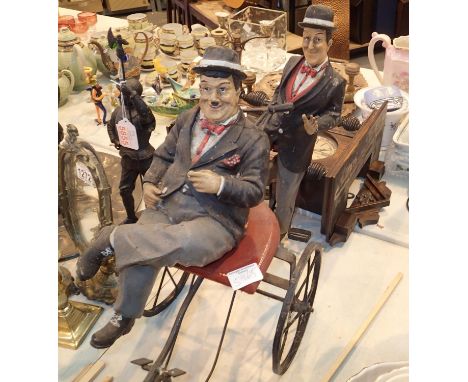 Resin Laurel &amp; Hardy figurines sat on metal tandem. Not available for in-house P&amp;P, contact Paul O'Hea at Mailboxes o