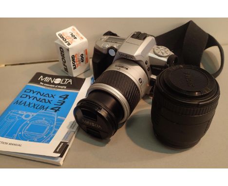 Minolta Dynax 4 film camera with 28-100 lens and Sigma 70-210 lens. P&amp;P Group 1 (£14+VAT for the first lot and £1+VAT for