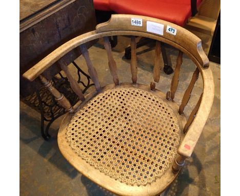 A wooden stick back elbow chair with cane seat. Not available for in-house P&amp;P, contact Paul O'Hea at Mailboxes on 01925 