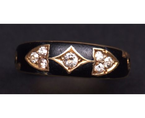 Late 19th century diamond set mourning ring, set with 7 small brilliant cut diamonds, the largest to the centre, within a bla