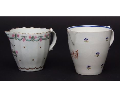 Two Lowestoft milk jugs circa 1790 the first of fluted shape with scalloped rim decorated with the so called Bungay pattern b