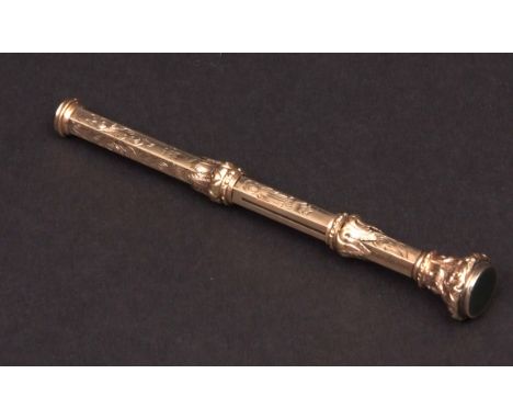 Late 19th century gold plated combination propelling pencil and dip pen of facetted cylindrical form with engraved decoration