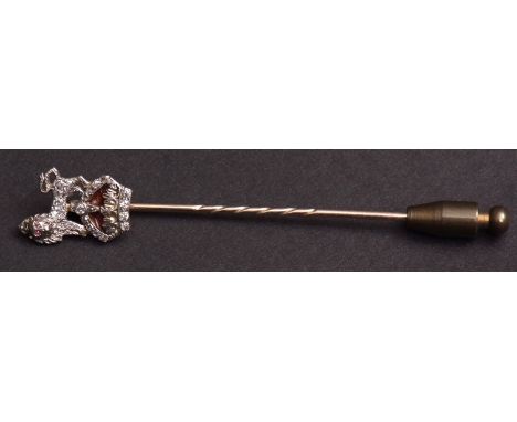 Yellow metal stick pin with diamond and enamel mounted finial of a lion above a crown, (possibly the insignia of The Royal Ar