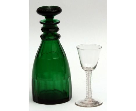 Decorative wine glass of plain funnel bowl, opaque twist stem and spreading circular foot, together with a green facetted gla