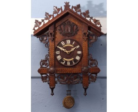 Late 19th century walnut and marquetry inlaid wall mounting musical cuckoo clock, retailed by Camerer, Kuss & Co, the archite
