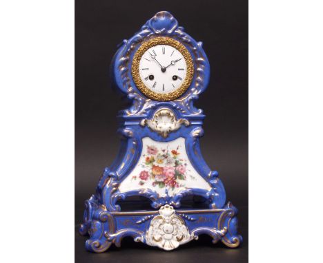 Mid-19th century French porcelain cased mantel clock and stand, the waisted case decorated with cobalt blue background and gi