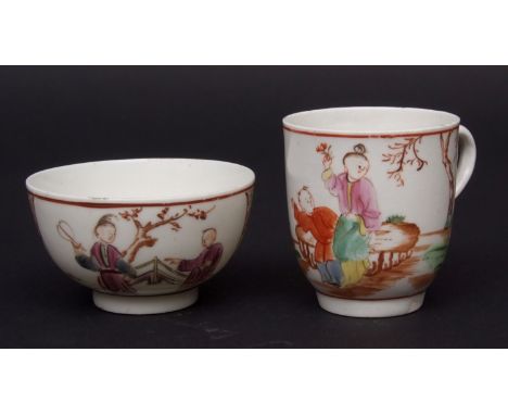 Lowestoft tea bowl and cup decorated in Mandarin style, the cup with Chinese figures by a fence in a garden with scroll decor