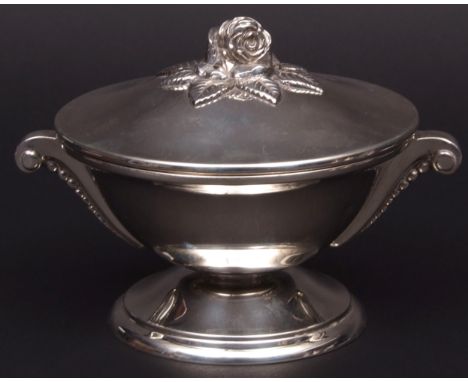Continental lidded bowl, the pull off cover with cast and applied rose finial, to a polished body with applied and scrolling 
