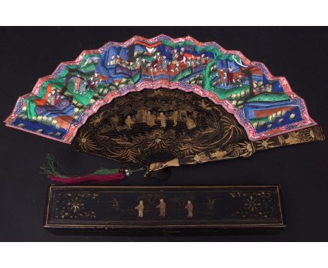 Late 19th/early 20th century cased Chinese black lacquer and gilt fan of 16 stick construction and decorated throughout with 