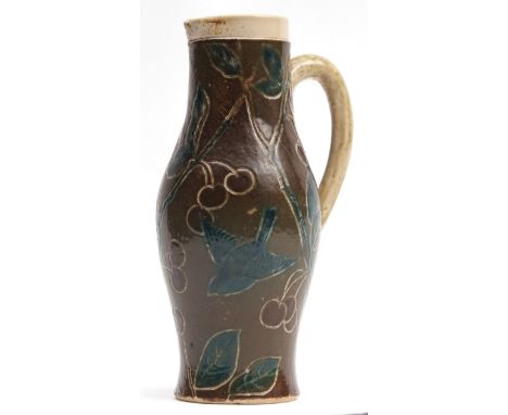 Martin ware jug, circa 1880, the brown ground with incised decoration of berries and birds in branches, picked out in green, 