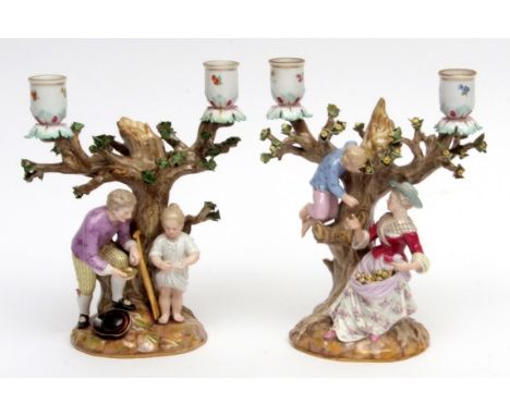 Pair of 19th century Meissen candelabra figures of a gardener and companion, and an apple picker, the sconces with floral spr
