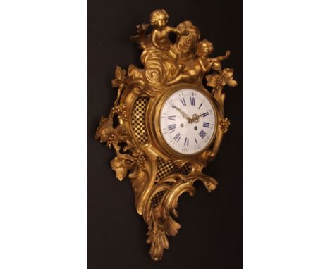 Mid-19th century French cast gilt brass cartel clock, the elaborate case surmounted by putto amongst stylised clouds over fol