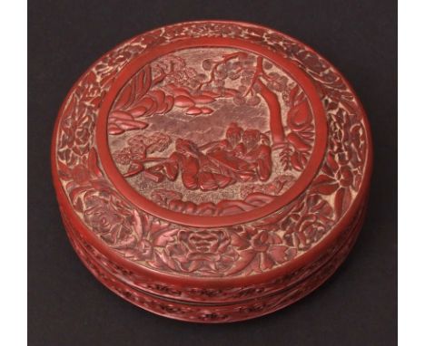 Good Chinese circular cinnabar lacquer box, well carved with a group of three scholars examining a scroll beneath trees in a 