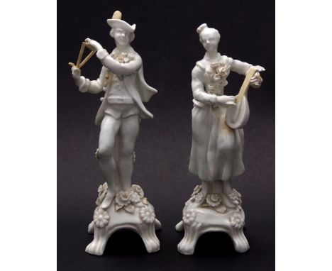 A very rare pair of Lowestoft white glazed figures circa 1770 crisply modelled as musicians in contemporary dress and dancing