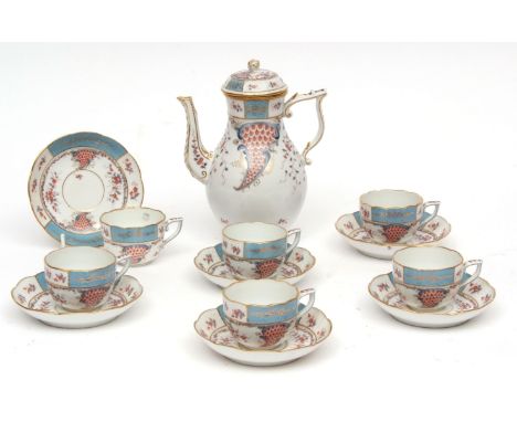 Herend coffee pot and six cups and saucers decorated in Meissen style with trailing flowers in enamel and gilt within borders